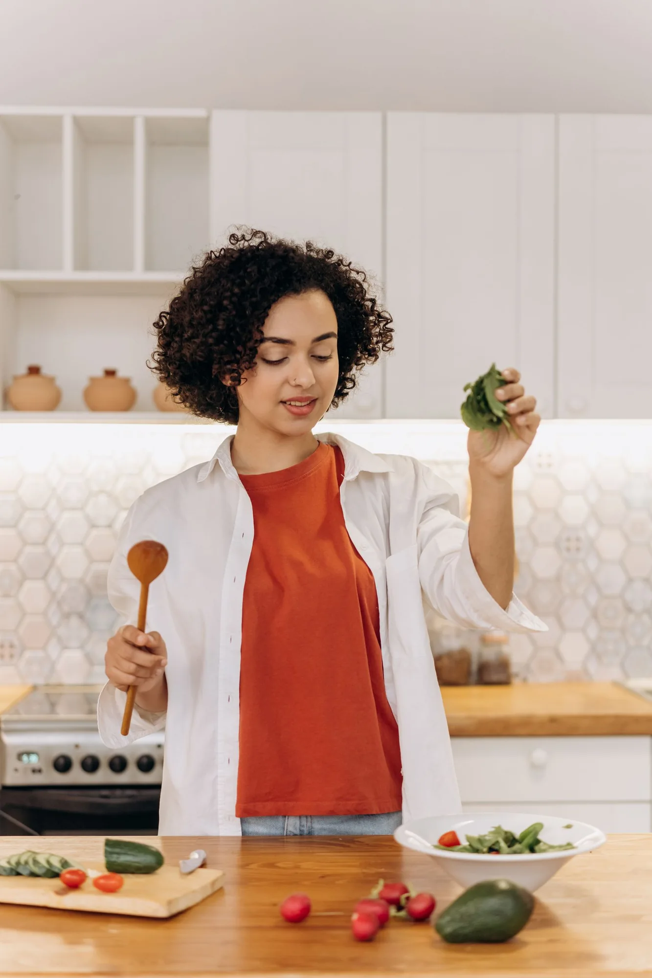 A woman preparing vegetables in her kitchen
