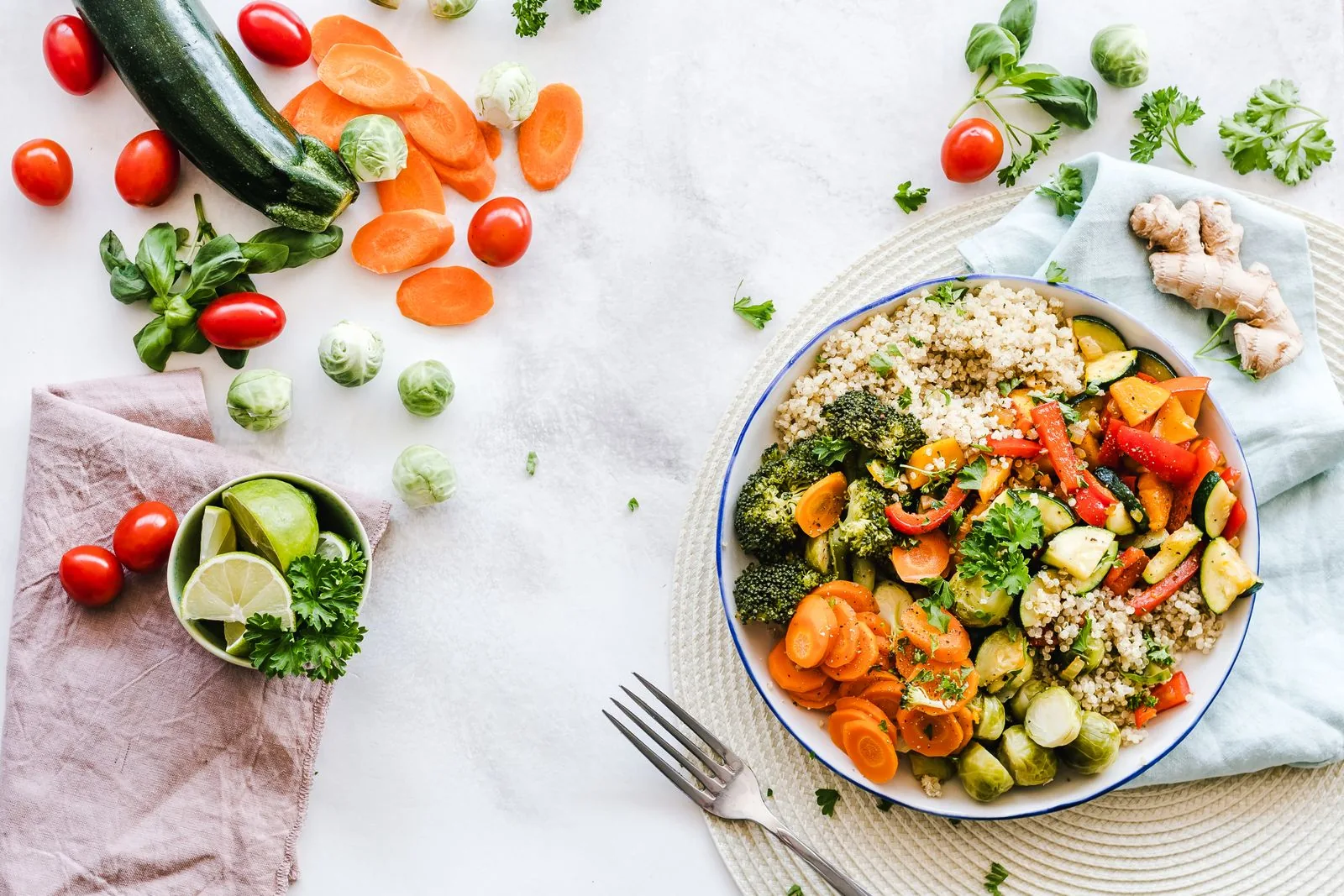 Colourful vegetables and quinoa arranged on a plate
